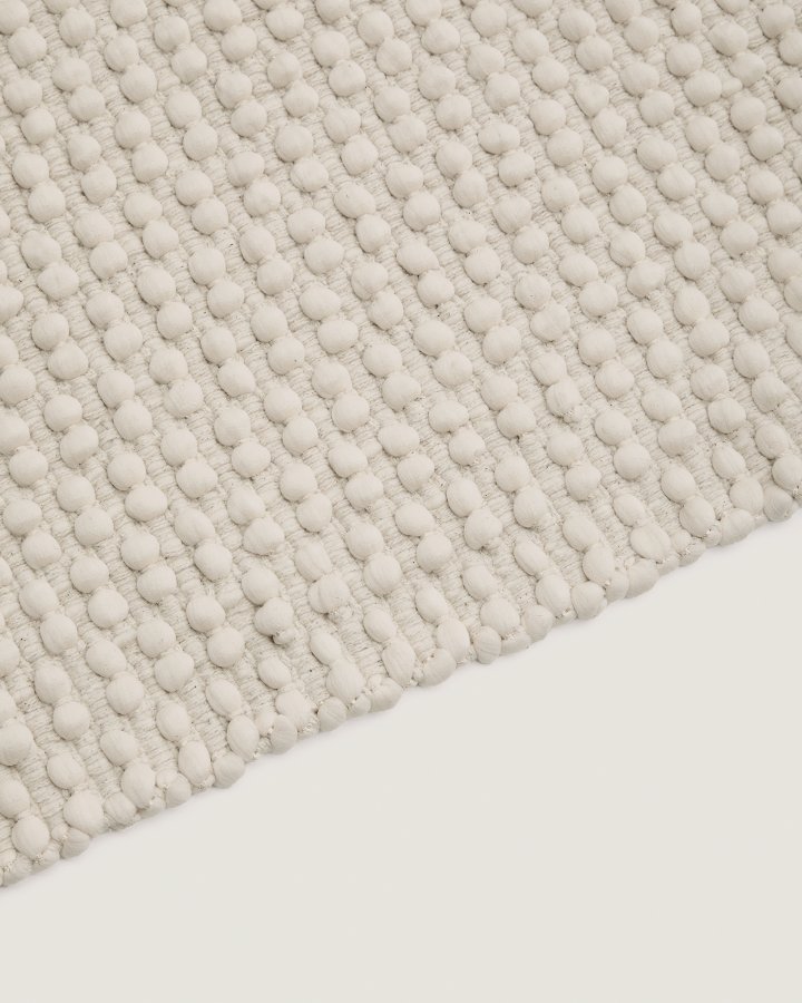 KAVE HOME Mascarell hvitt teppe laget av bomull og polyester 70 x 140 cm